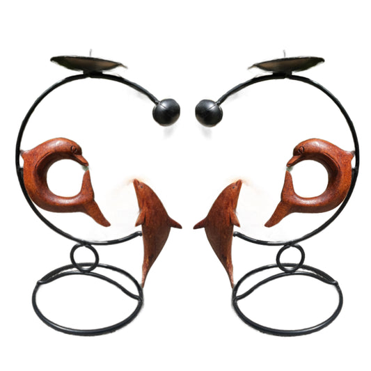 Handmade dolphin candle holders, crafted from wood, with a simple and elegant design, displayed on a white background.