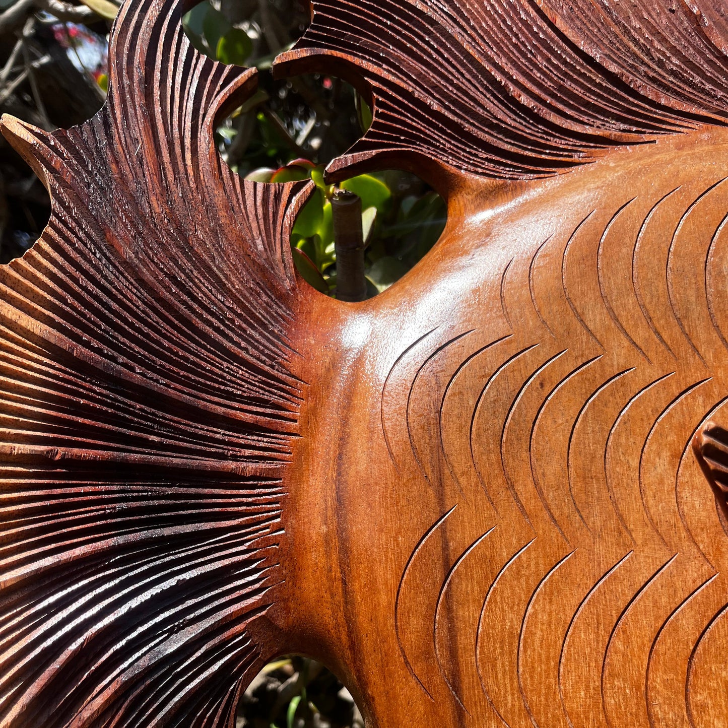 Intricately hand-carved wooden fish made from durable tropical hardwood, showcasing lifelike detail and a sleek, natural finish. A timeless decorative piece that brings ocean-inspired charm and artisan craftsmanship to any coastal or nautical-themed space.