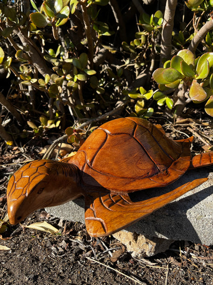 A detailed close-up of the hand-carved turtle's fins, showcasing the intricate craftsmanship and lifelike texture. The fine details in the fins add a realistic and artistic touch to this unique sculpture, emphasizing its delicate and natural form.