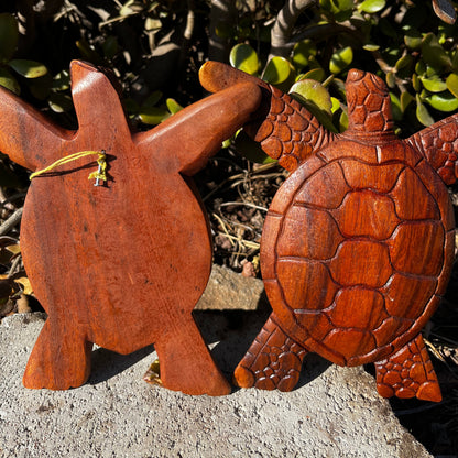 A hand-carved wooden turtle wall plaque displayed from both the front and back, showcasing intricate details and the attached hook for easy hanging.