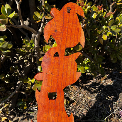 Back view of a hand-carved wooden turtle wall plaque featuring three turtles. Shows the smooth mahogany wood finish and the attached hook for easy wall mounting