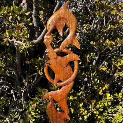 Wooden dolphin plaque dolphin pod kissing and swimming together side vide of vertical hanging